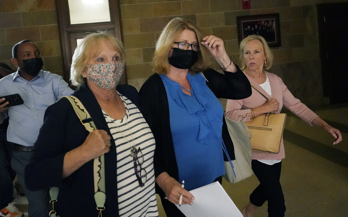 Favre texted frequently with New (second from right), who oversaw millions of dollars of welfare distribution in Mississippi.